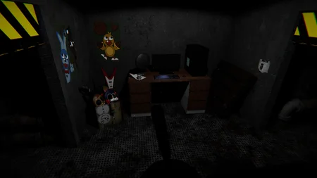 After Fright security office with desk, computer, animatronic parts and children's drawings on the wall